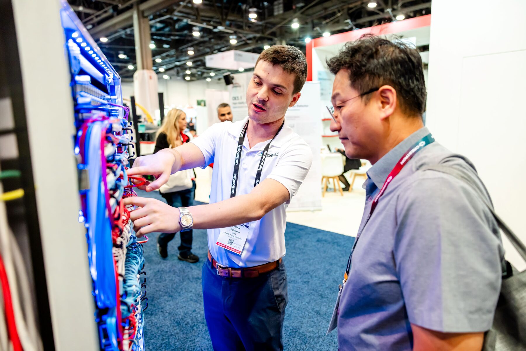 InfoComm show floor, interaction at exhibitor booth